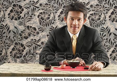 Man having meal at restaurant View Large Photo Image Stock Photo - Man having meal at restaurant. Fotosearch