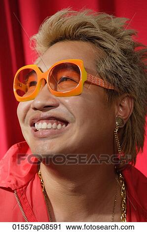 Stock Image - Man in hip hop outfit having fun. Fotosearch
