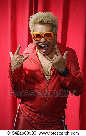 Stock Image - Man in hip hop outfit having fun. Fotosearch