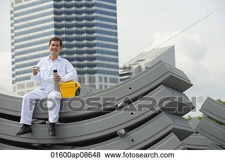 Man in protecting clothing taking a break View Large Photo Image Stock Photo - Man in protecting clothing taking a break. Fotosearch