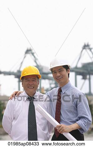 Men with helmets looking at camera View Large Photo Image Stock Image - Men with helmets looking at camera. Fotosearch