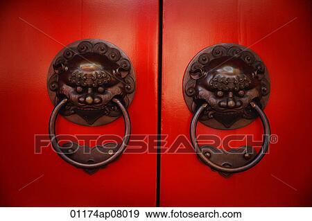 Pair Of Brass Lion Head Door Knockers At Temple Stock Photo