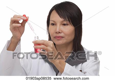 Scientist holding pipette and flask View Large Photo Image Stock Photography - Scientist holding pipette and flask. Fotosearch