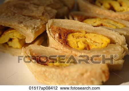 Stock Image - Still life of pastry with pork floss and egg yolk. Fotosearch