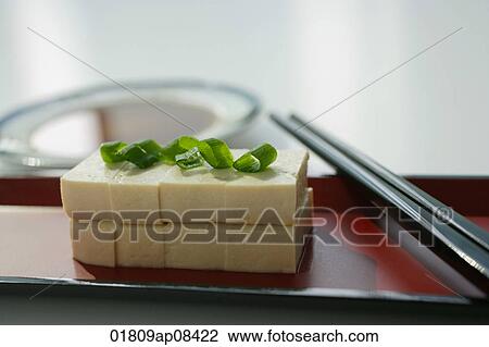 Still life of stacks of sliced beancurd with spring onion View Large Photo Image Stock Image - Still life of stacks of sliced beancurd with spring onion. Fotosearch