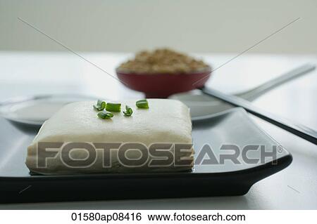 Still life of tofu with spring onions and soya beans View Large Photo Image Stock Photograph - Still life of tofu with spring onions and soya beans. Fotosearch