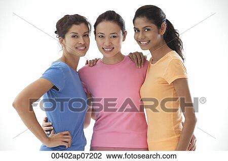 Three women of mixed race, smiling at camera, portrait View Large Photo Image Stock Image - Three women of mixed race, smiling at camera, portrait. Fotosearch