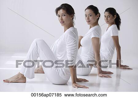 three women sitting on floor, side view, looking at camera View Large Photo Image Stock Photography - three women sitting on floor, side view, looking at camera. Fotosearch