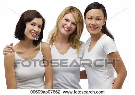 Three young woman wearing white shirts and smiling at camera View Large Photo Image Stock Image - Three young woman wearing white shirts and smiling at camera. Fotosearch