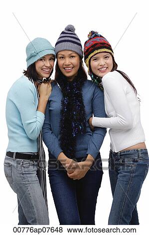 Three young women wearing scarves and hats, winter View Large Photo Image Stock Photo - Three young women wearing scarves and hats, winter. Fotosearch