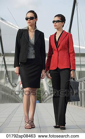 Two businesswomen looking into distance View Large Photo Image Stock Image - Two businesswomen looking into distance. Fotosearch