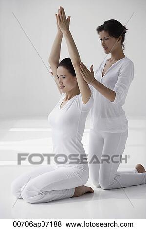 two women practicing yoga postures, teaching View Large Photo Image Stock Photo - two women practicing yoga postures, teaching. Fotosearch