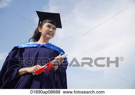 University student in graduation robe cheering View Large Photo Image Stock Photo - University student in graduation robe cheering. Fotosearch