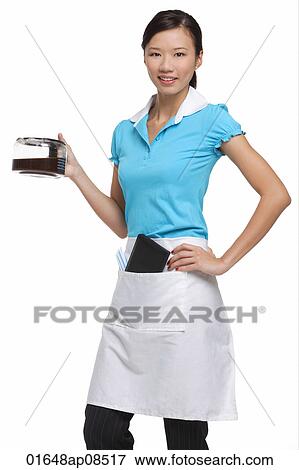 Waitress smiling at camera, holding coffee View Large Photo Image Stock Photo - Waitress smiling at camera, holding coffee. Fotosearch