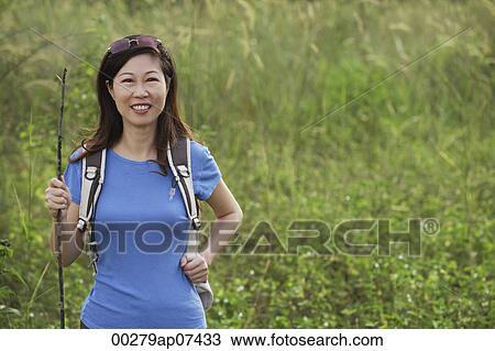 Woman hiking in nature, outdoors View Large Photo Image Stock Image - Woman hiking in nature, outdoors. Fotosearch