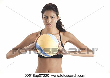 Woman holding volleyball, getting ready to pass ball, playing sports View Large Photo Image Stock Image - Woman holding volleyball, getting ready to pass ball, playing sports. Fotosearch