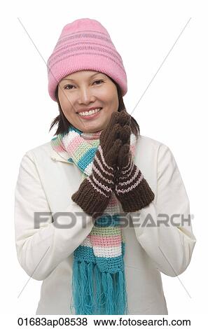 Woman in winter clothing smiling at camera View Large Photo Image Stock Photo - Woman in winter clothing smiling at camera. Fotosearch