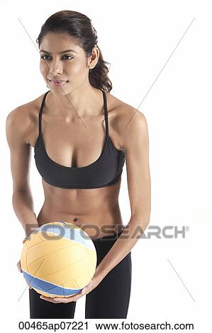 Woman serving volleyball, playing sports View Large Photo Image Stock Image - Woman serving volleyball, playing sports. Fotosearch