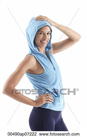 Woman smiling looking at camera, wearing a hooded vest View Large Photo Image Stock Image - Woman smiling looking at camera, wearing a hooded vest. Fotosearch