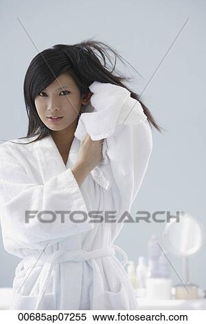woman wearing bathrobe, towel drying hair, looking at camera View Large Photo Image Stock Photography - woman wearing bathrobe, towel drying hair, looking at camera. Fotosearch