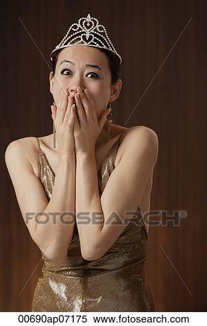 woman wearing crown, excited, winner, hands over mouth View Large Photo Image Stock Photography - woman wearing crown, excited, winner, hands over mouth. Fotosearch