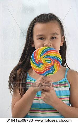 Stock Photograph - Young girl with big lollipop. Fotosearch