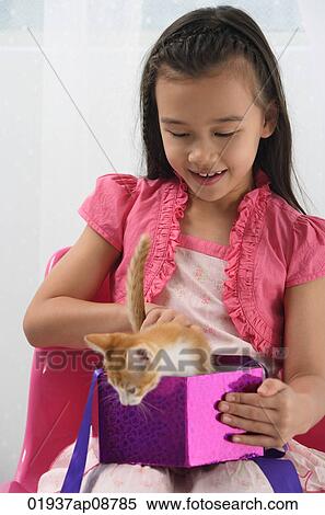 Young girl with kitten on her lap View Large Photo Image Stock Photography - Young girl with kitten on her lap. Fotosearch