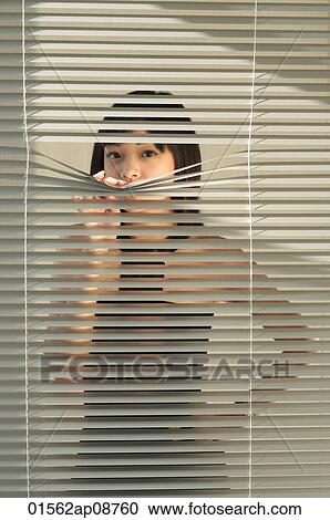 Young woman behind Venetian blinds View Large Photo Image Stock Image - Young woman behind Venetian blinds. Fotosearch
