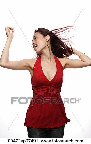 Young woman dancing, hair blowing View Large Photo Image Stock Image - Young woman dancing, hair blowing. Fotosearch