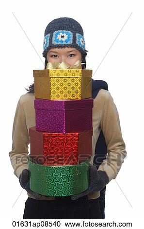 Young woman holding gift boxes View Large Photo Image Stock Image - Young woman holding gift boxes. Fotosearch