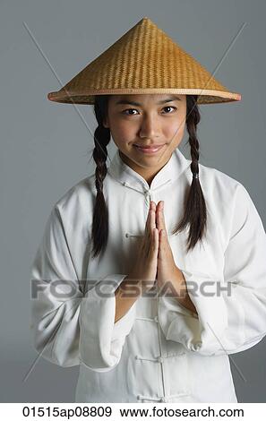 Young woman in traditional Chinese dress looking at camera View Large Photo Image Stock Photo - Young woman in traditional Chinese dress looking at camera. Fotosearch