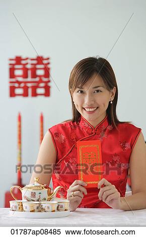 Young woman in traditional clothing, smiling at camera View Large Photo Image Stock Photography - Young woman in traditional clothing, smiling at camera. Fotosearch