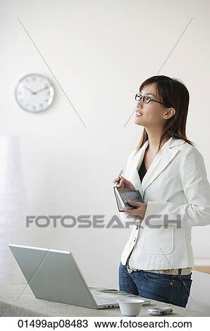 Young woman looking into distance View Large Photo Image Stock Image - Young woman looking into distance. Fotosearch