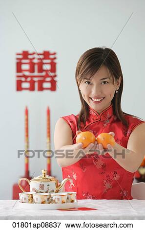 Young woman performing tea ceremony and smiling at camera View Large Photo Image Stock Photo - Young woman performing tea ceremony and smiling at camera. Fotosearch