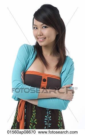 Young woman smiling at camera View Large Photo Image Stock Image - Young woman smiling at camera. Fotosearch