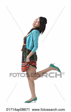 Young woman smiling at camera View Large Photo Image Stock Image - Young woman smiling at camera. Fotosearch
