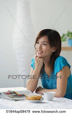 Young woman smiling into distance View Large Photo Image Stock Photo - Young woman smiling into distance. Fotosearch