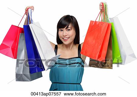 Young woman wearing blue dress and holding colorful shopping bags up in air View Large Photo Image Stock Photo - Young woman wearing blue dress and holding colorful shopping bags up in air. Fotosearch