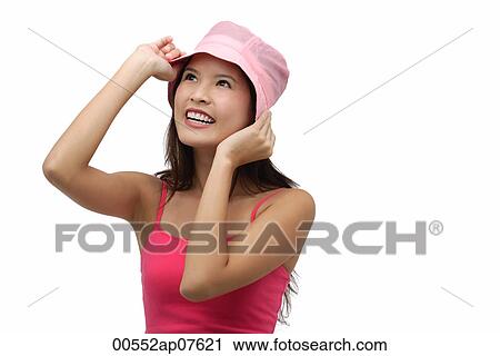 Young woman wearing pink hat and smiling View Large Photo Image Stock Image - Young woman wearing pink hat and smiling. Fotosearch
