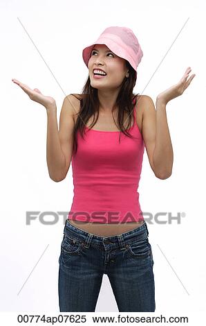 Young woman wearing pink hat with arms raised up View Large Photo Image Stock Photography - Young woman wearing pink hat with arms raised up. Fotosearch