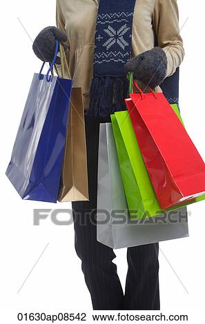 Stock Image - Young woman with shopping bags. Fotosearch