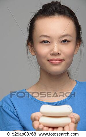 Young woman with soap smiling at camera View Large Photo Image Stock Photo - Young woman with soap smiling at camera. Fotosearch