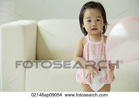Baby girl with balloon View Large Photo Image Picture - Baby girl with balloon. Fotosearch
