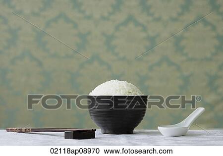 Bowl of rice with chopsticks View Large Photo Image Stock Image - Bowl of rice with chopsticks. Fotosearch