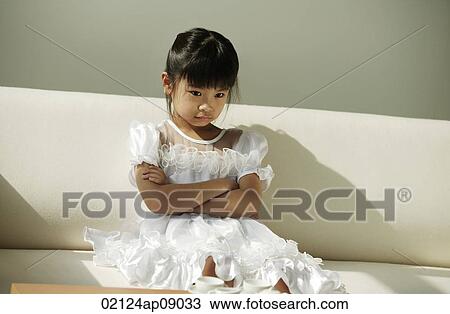Girl in white dress pouting View Large Photo Image Stock Image - Girl in white dress pouting. Fotosearch