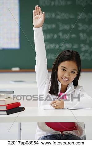 Girl raising hand in class View Large Photo Image Picture - Girl raising hand in class. Fotosearch