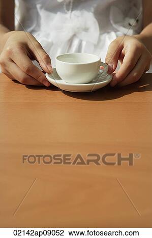 Girl with toy tea cup View Large Photo Image Stock Image - Girl with toy tea cup. Fotosearch