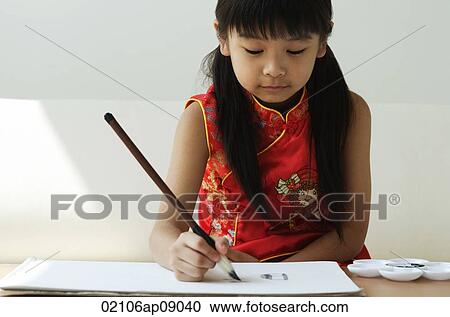 Young girl practicing calligraphy View Large Photo Image Stock Image - Young girl practicing calligraphy. Fotosearch