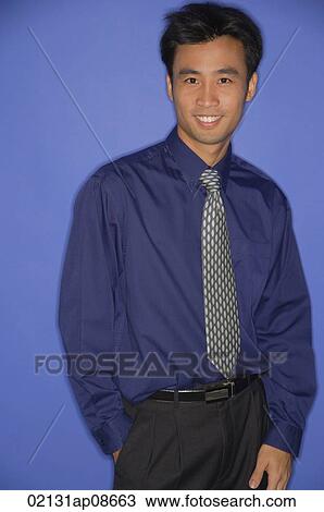 Young man smiling at camera View Large Photo Image Stock Image - Young man smiling at camera. Fotosearch