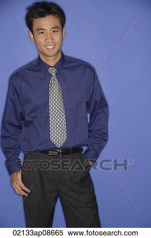 Stock Photography - Young man smiling at camera. Fotosearch